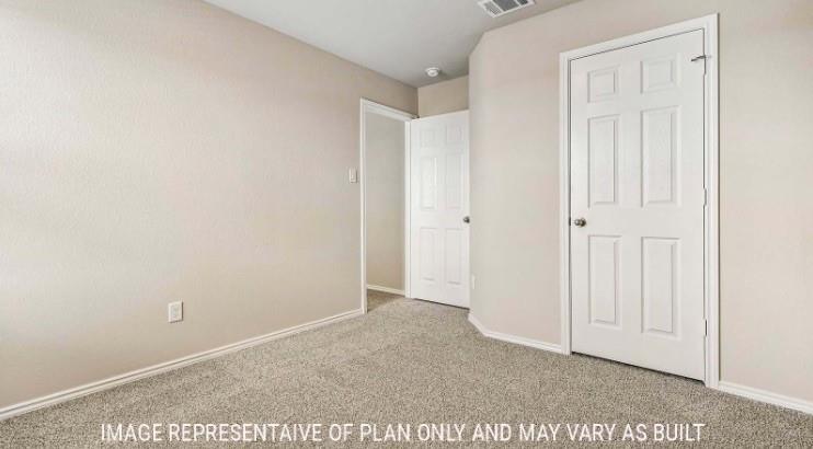 10101 Altair Drive Waco, TX 76708 - Photo 27 of 36 Neutral-toned walls, textured carpeting, and white six-panel doors