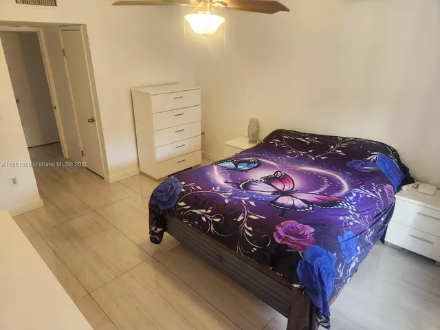 a bedroom with a bed and a closet