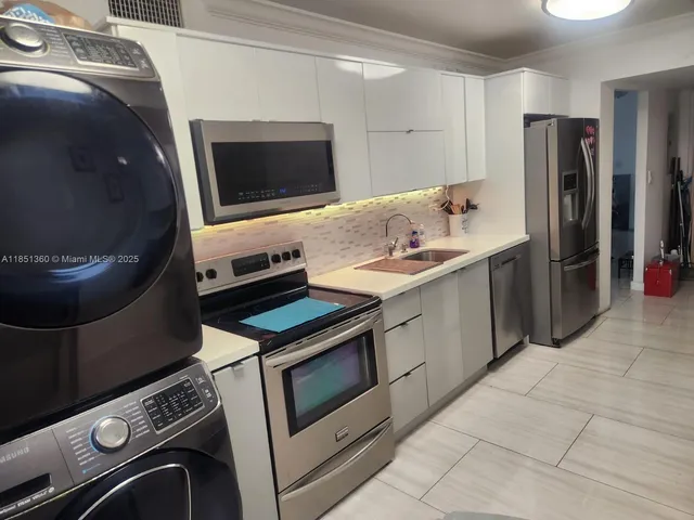 a kitchen with a stove and a microwave