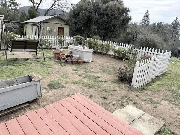 a view of a backyard with sitting area and entertaining space