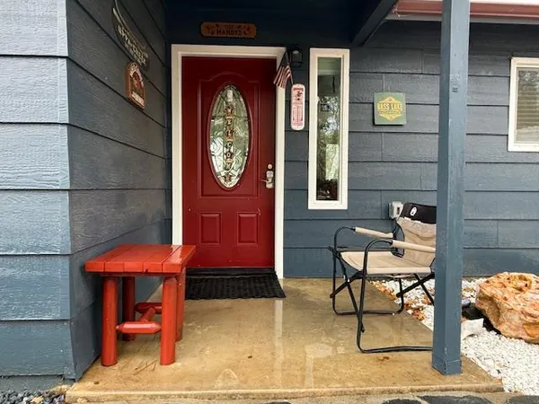 a view of a dinning room with a bench and table