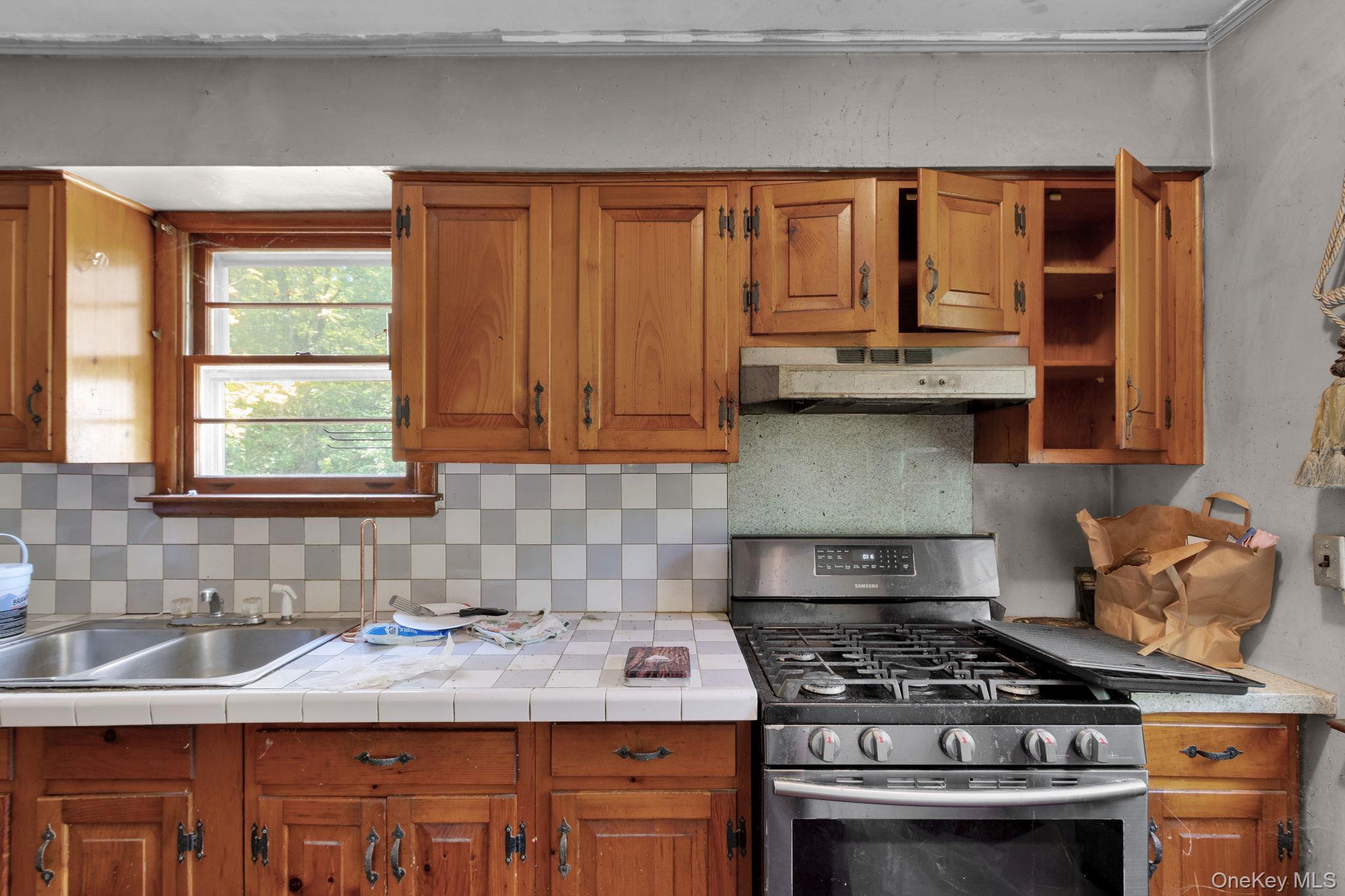 31 Foster Road Cairo, NY 12413 - Photo 11 of 38 a kitchen with stainless steel appliances granite countertop a stove and a sink
