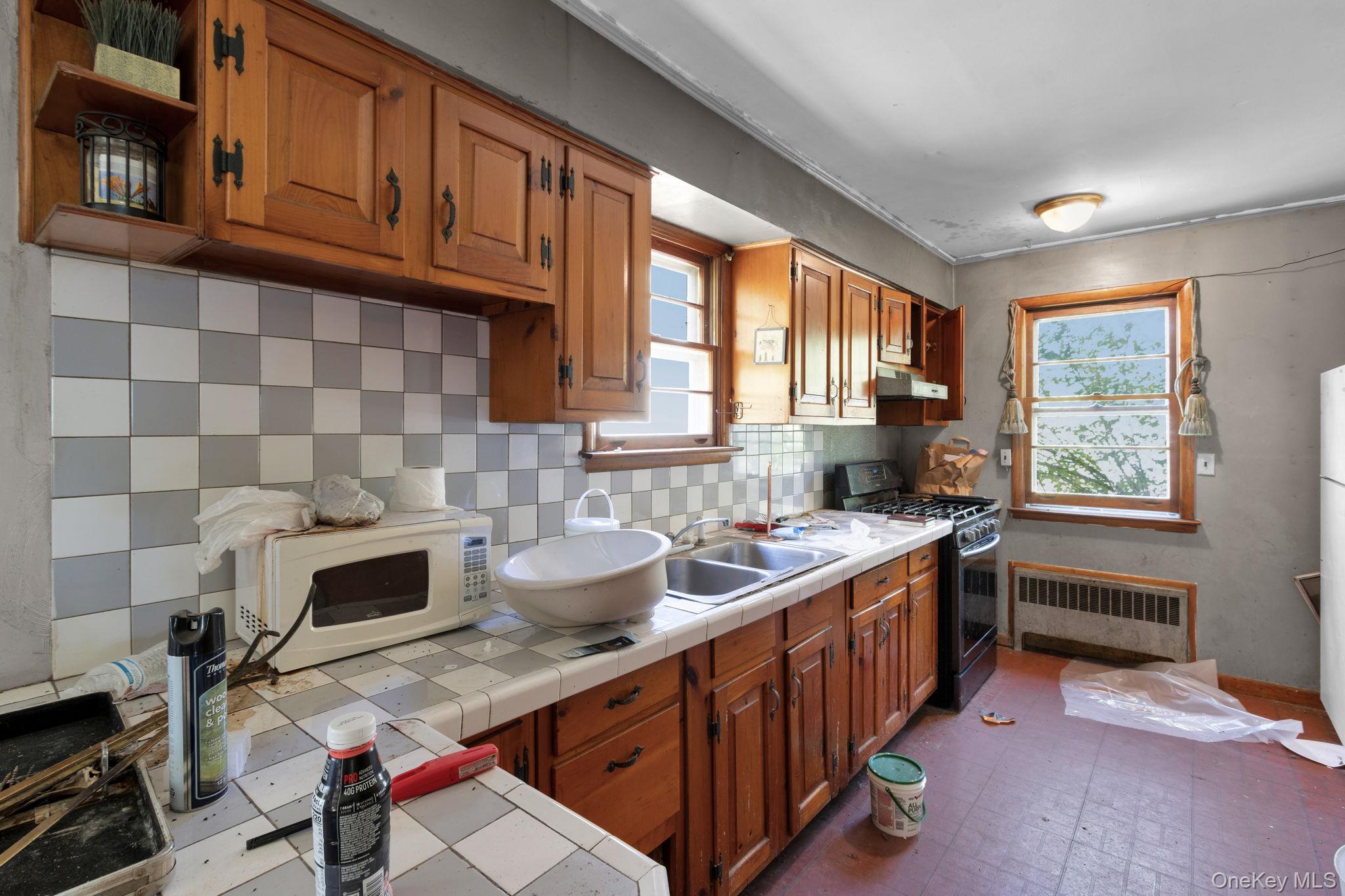 31 Foster Road Cairo, NY 12413 - Photo 13 of 38 a kitchen with a sink appliances cabinets and a window