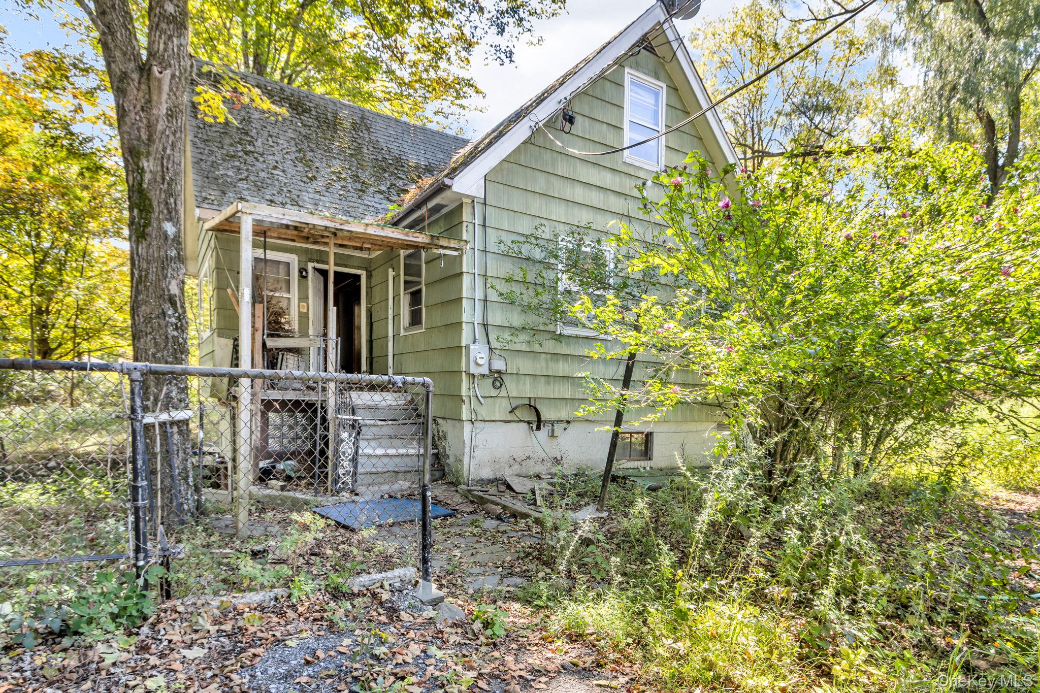 31 Foster Road Cairo, NY 12413 - Photo 3 of 38 a backyard of a house with table and chairs