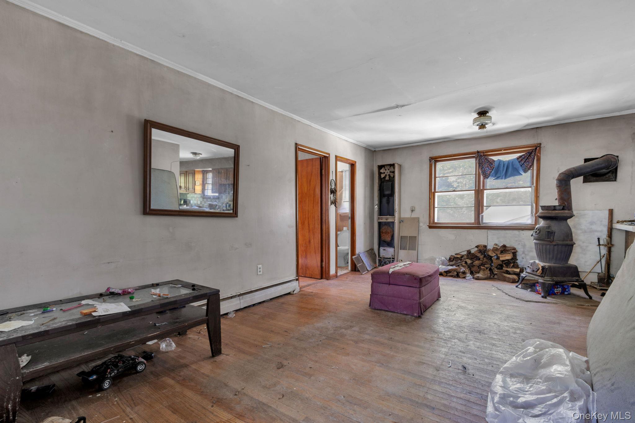 31 Foster Road Cairo, NY 12413 - Photo 8 of 38 a living room with furniture gym equipment and a window
