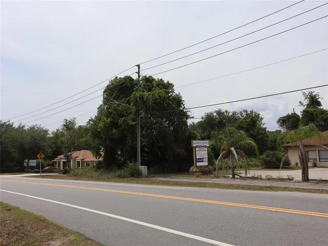 a view of a town with barn house