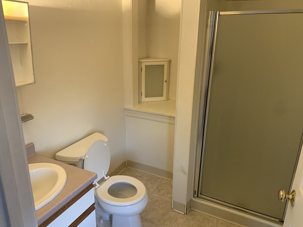 356 East Merrimack Street, Unit 5 Lowell, MA 01852 - Photo 5 of 8 a bathroom with a sink and a toilet