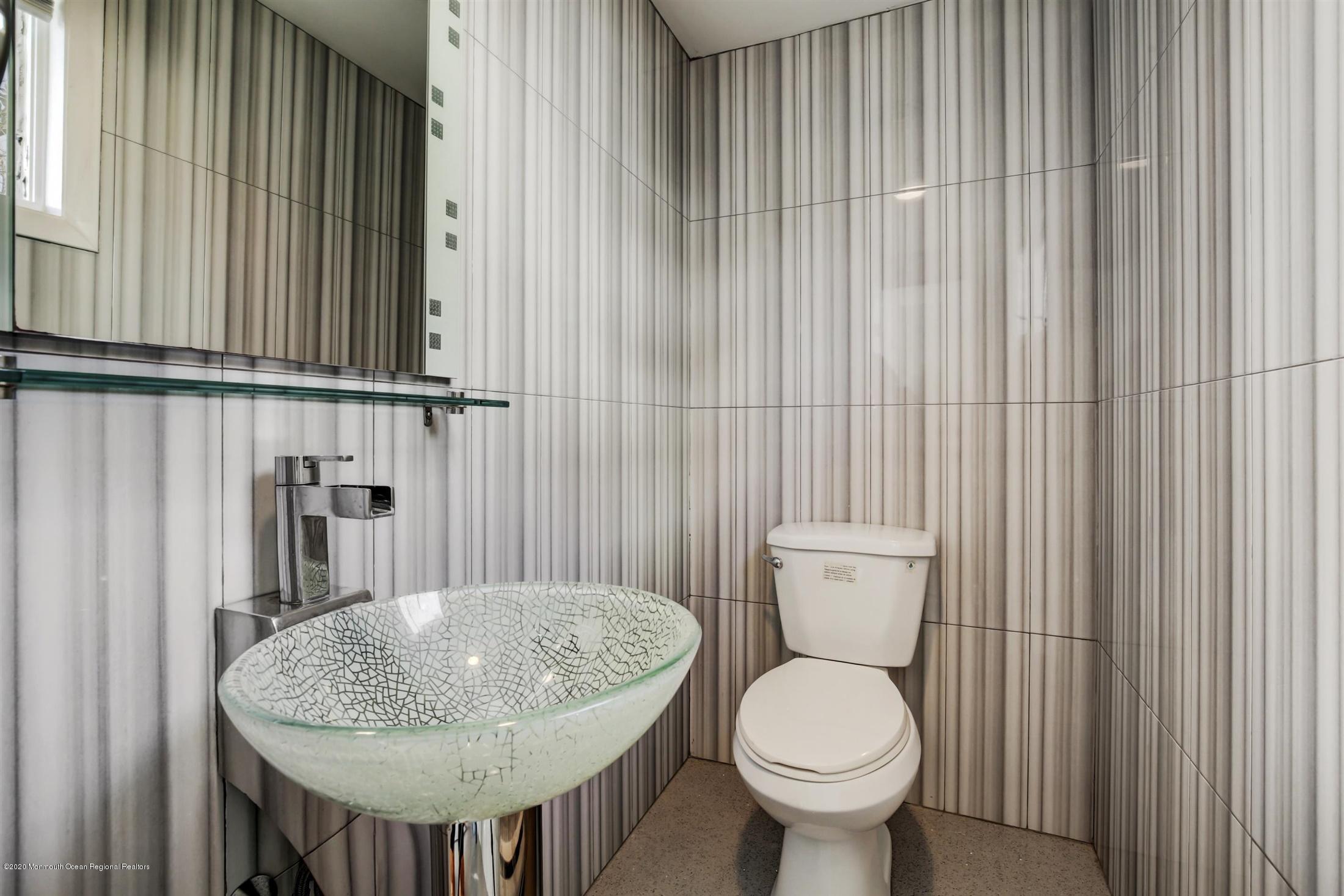 60 Monmouth Drive Deal, NJ 07723 - Photo 16 of 33 a bathroom with a toilet and a sink