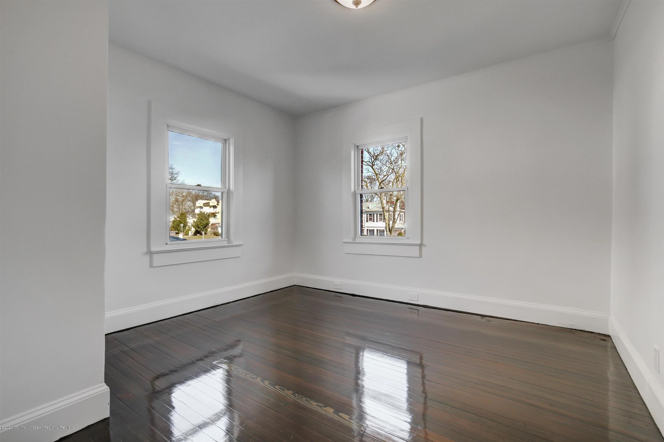 60 Monmouth Drive Deal, NJ 07723 - Photo 22 of 33 wooden floor in an empty room with a window
