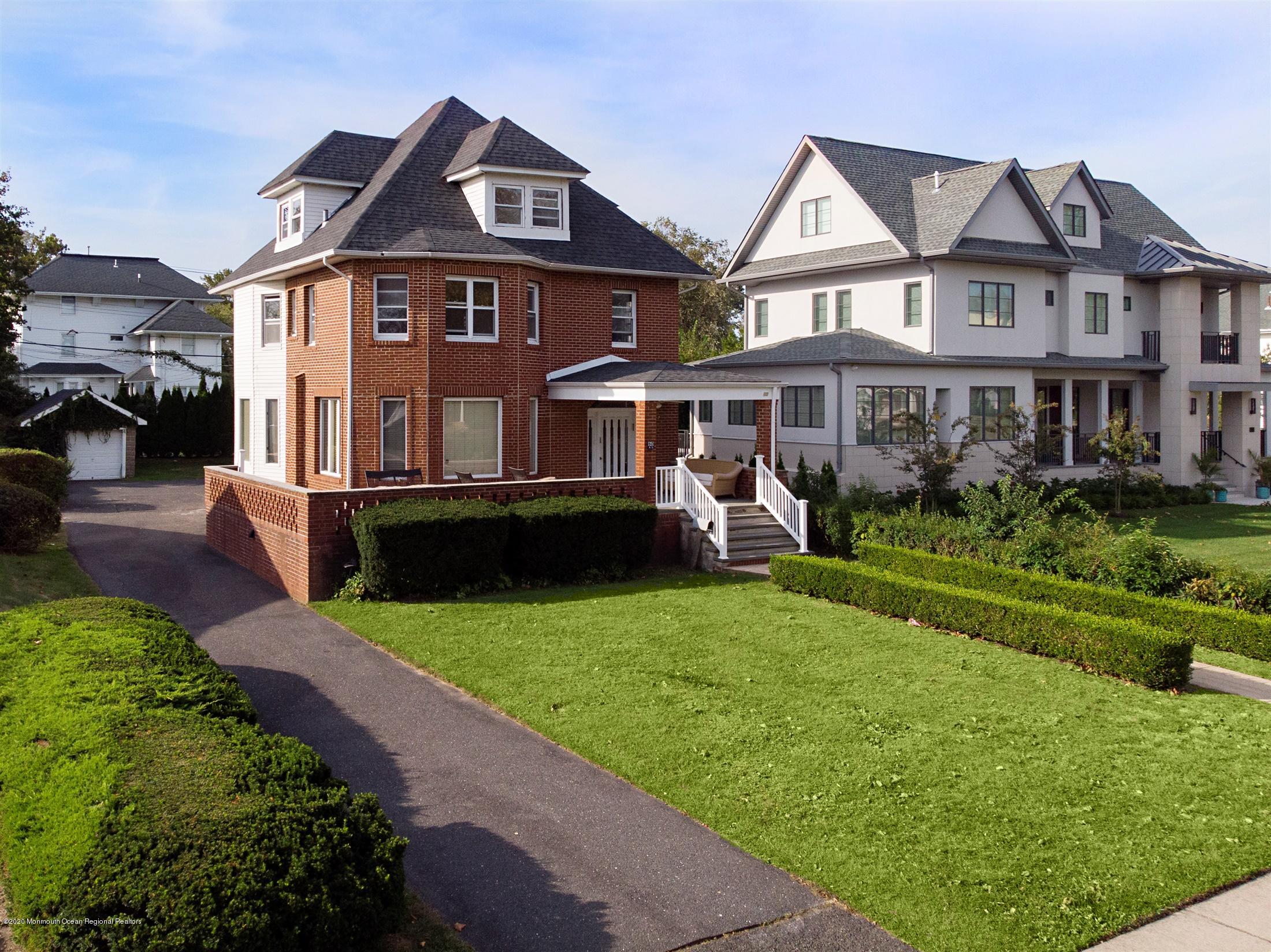 60 Monmouth Drive Deal, NJ 07723 - Photo 23 of 33 a front view of a house with a garden and plants
