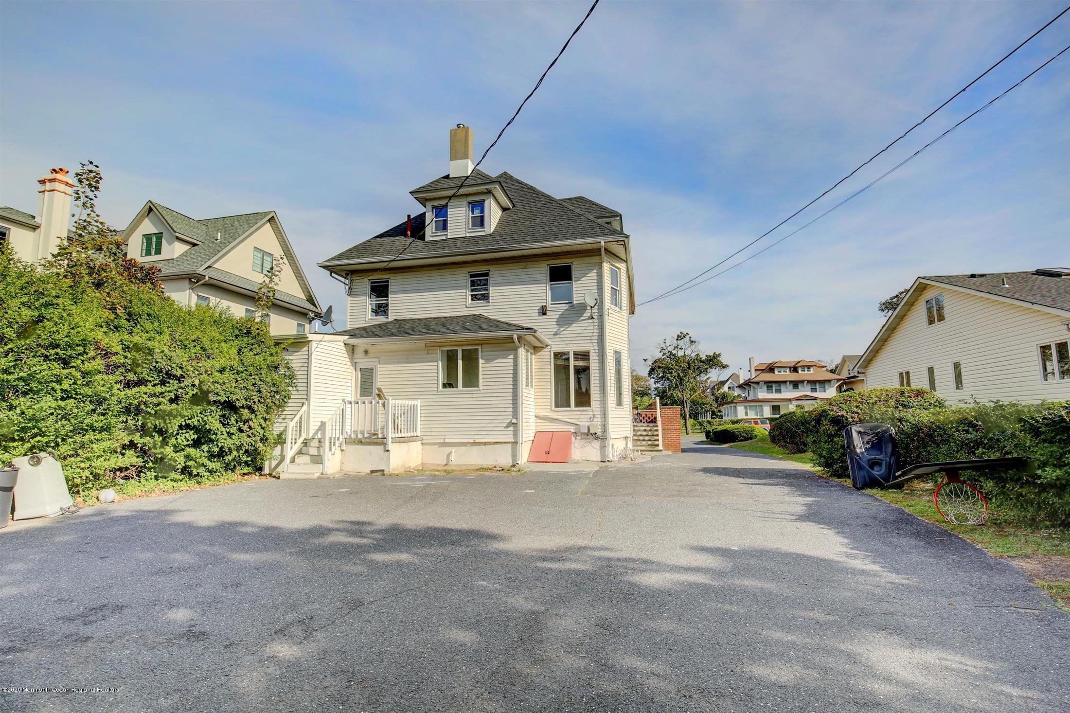 60 Monmouth Drive Deal, NJ 07723 - Photo 26 of 33 a view of a house with a yard and potted plants