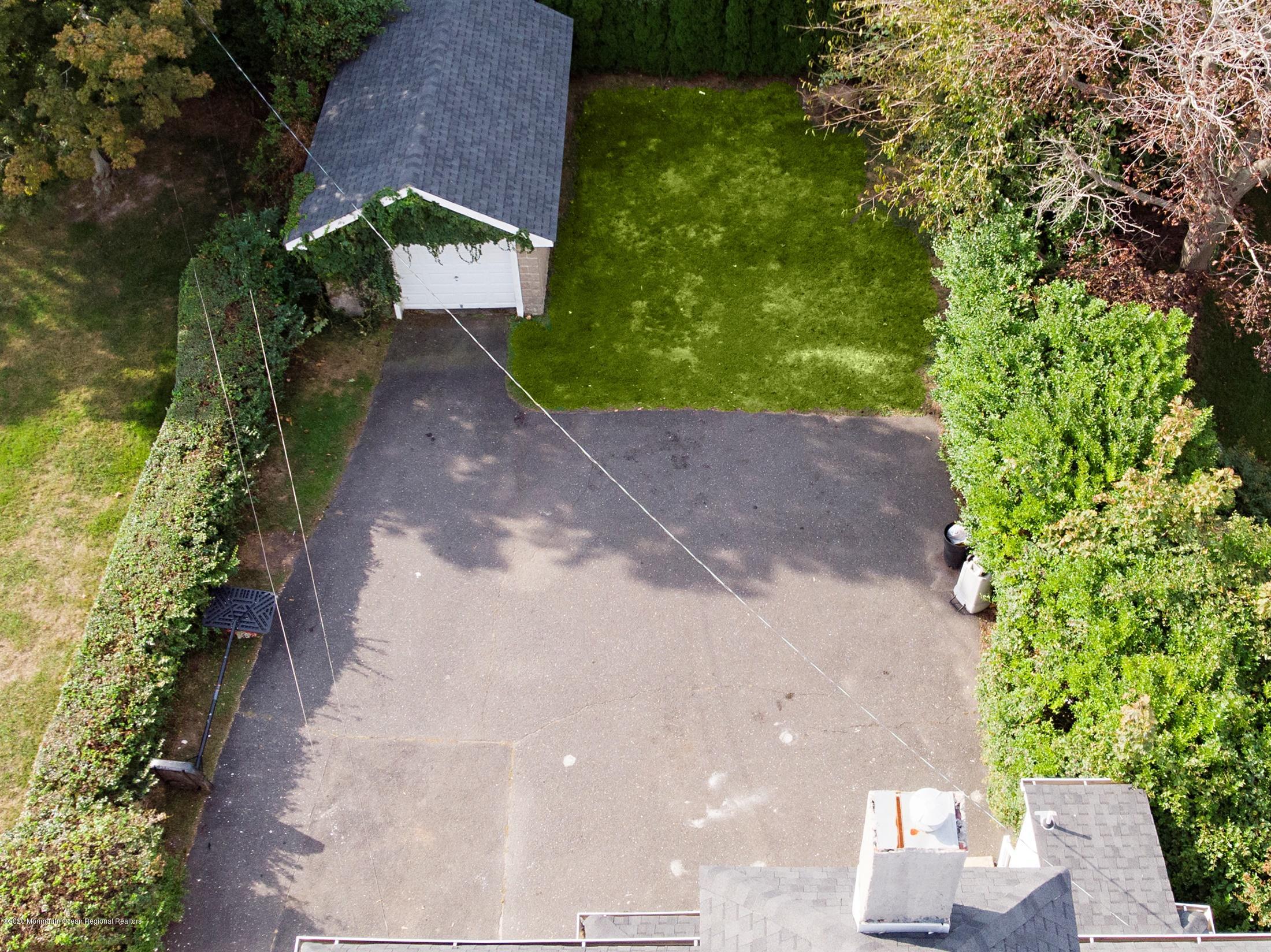 60 Monmouth Drive Deal, NJ 07723 - Photo 27 of 33 a view of a pathway with a yard