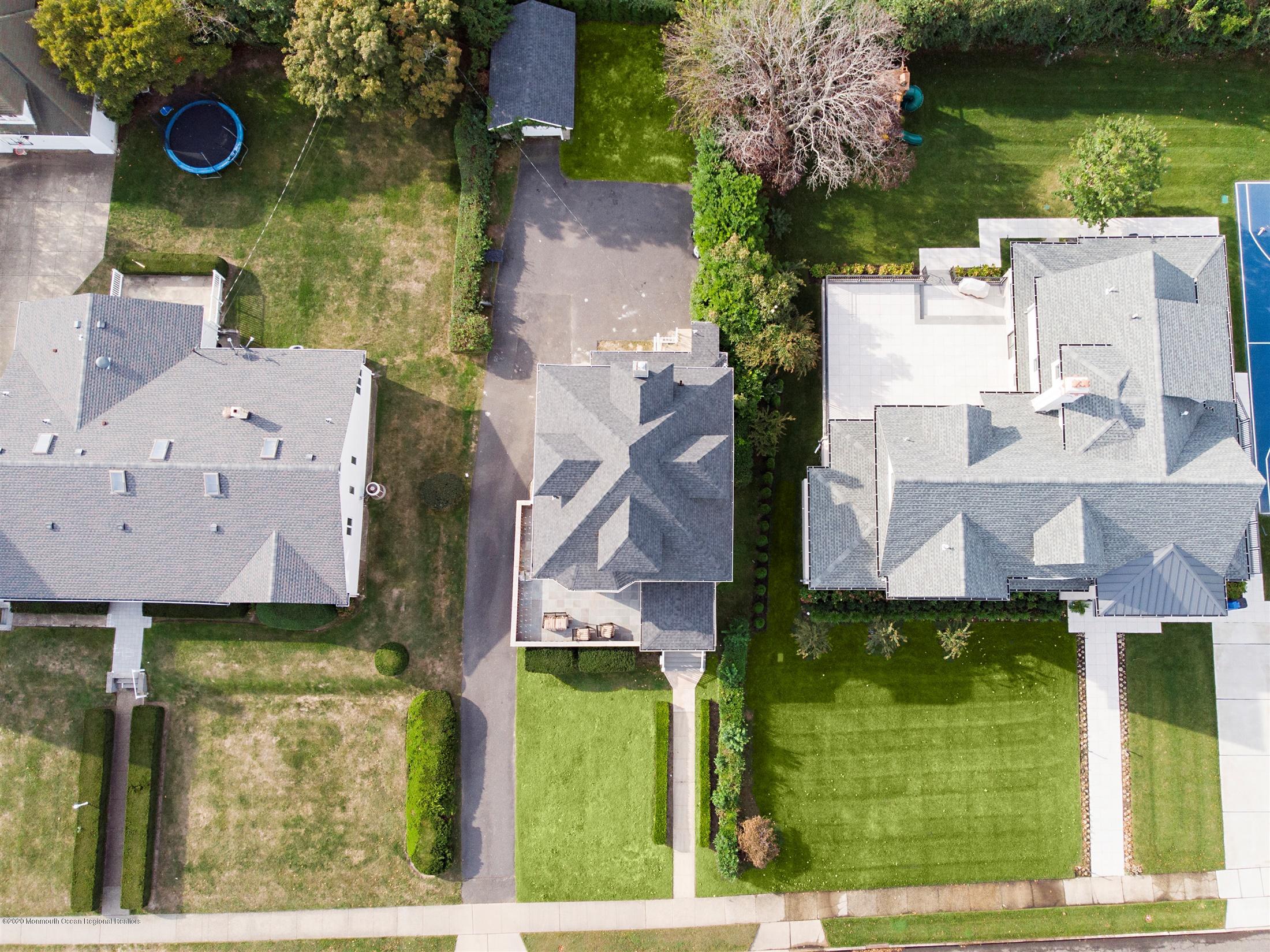 60 Monmouth Drive Deal, NJ 07723 - Photo 29 of 33 an aerial view of residential houses with outdoor space and parking