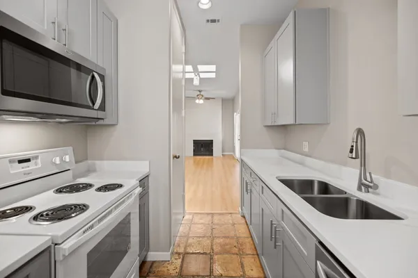 a kitchen with a stove and a microwave