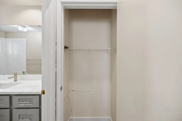 a bathroom with a sink and mirror