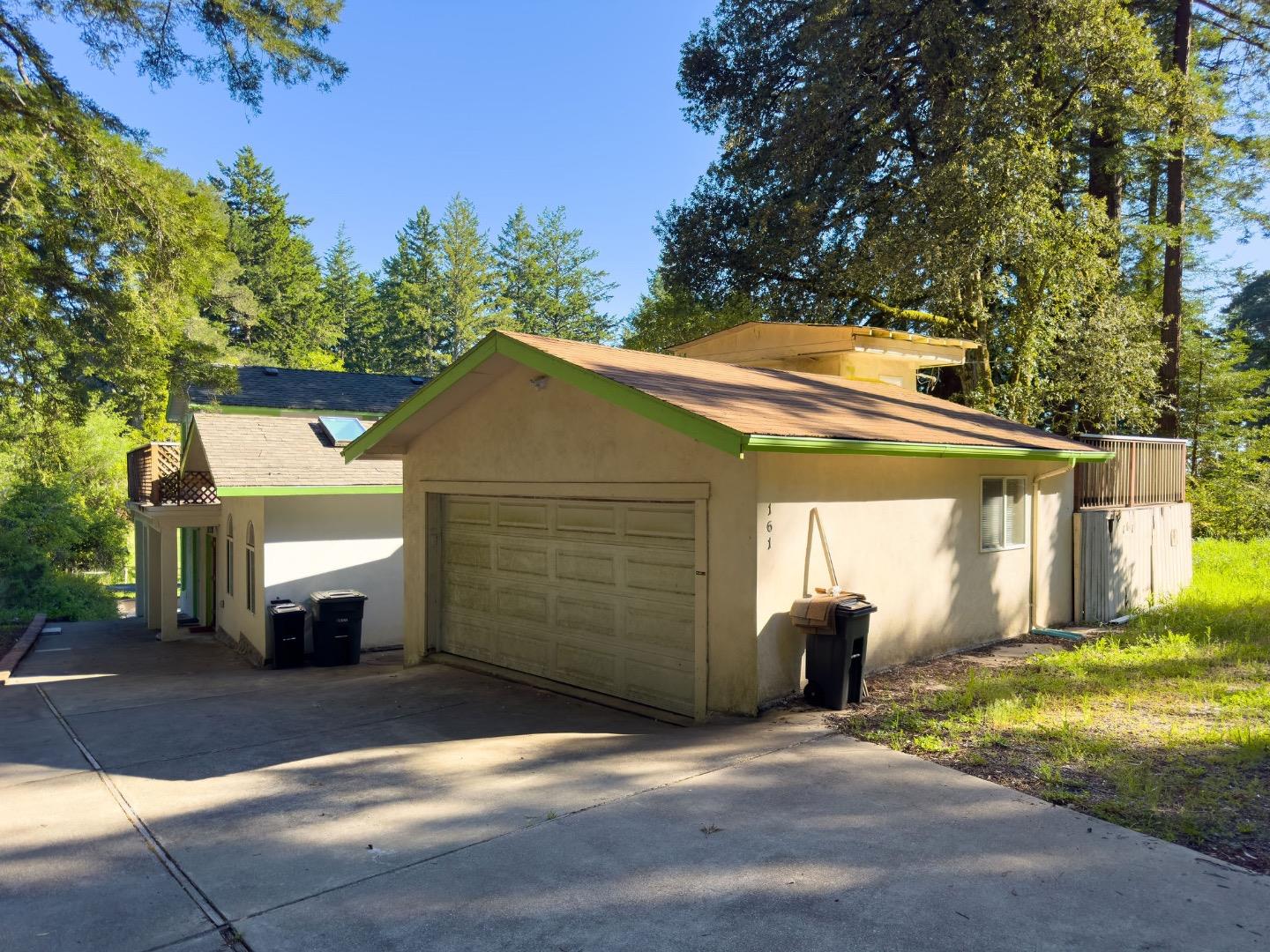 161 Ware Road Woodside, CA 94062 - Photo 13 of 52 a view of a house with a yard and garage