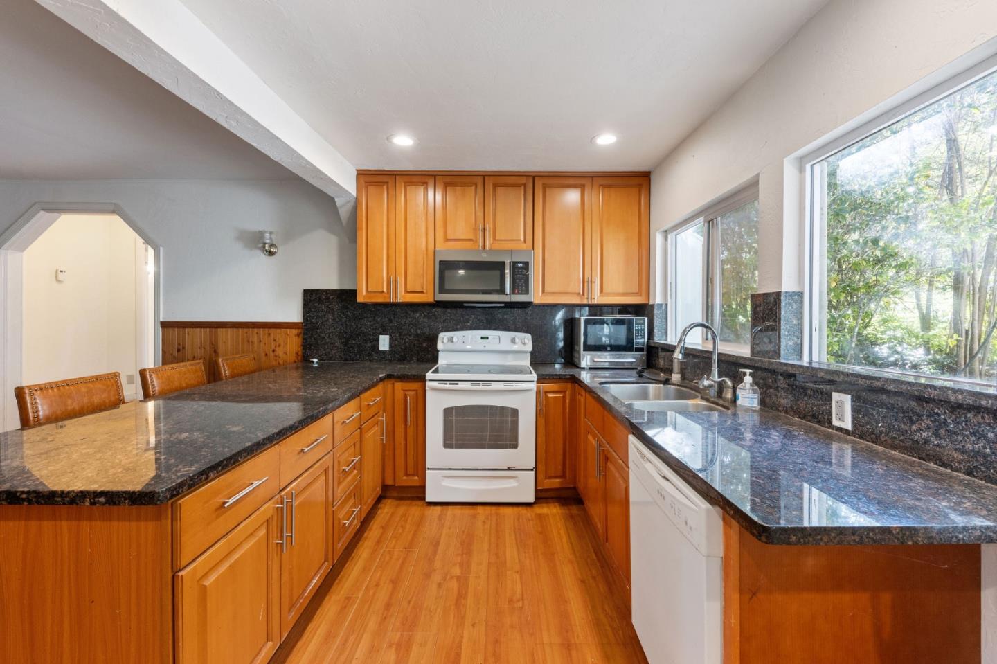 161 Ware Road Woodside, CA 94062 - Photo 32 of 52 a kitchen with granite countertop a sink a counter top space and stainless steel appliances