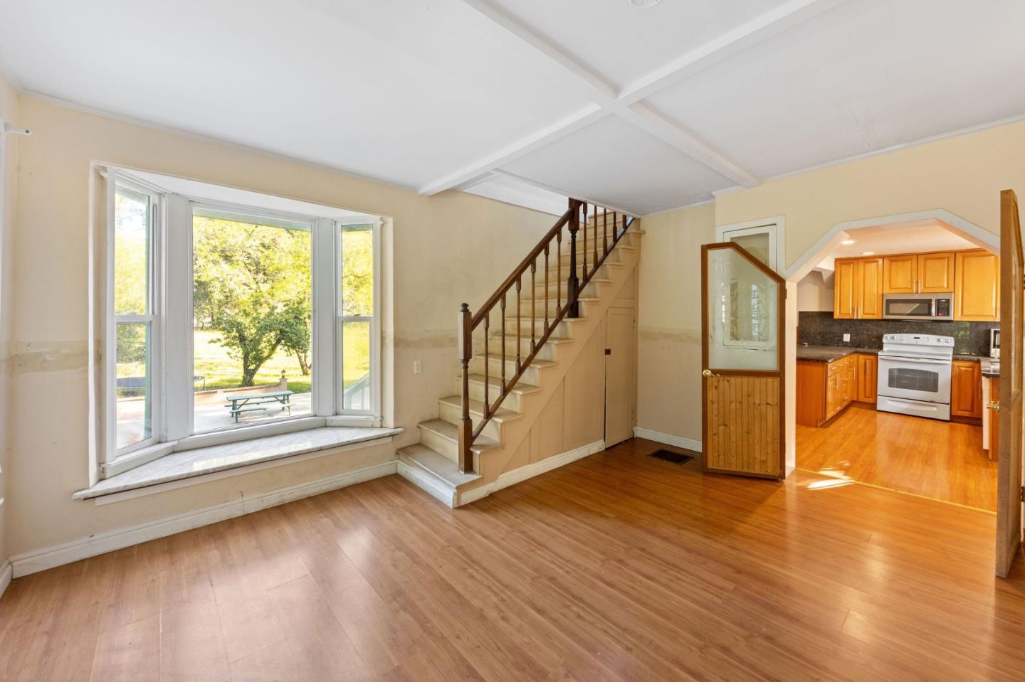 161 Ware Road Woodside, CA 94062 - Photo 44 of 52 a view of an empty room with window wooden floor and a kitchen