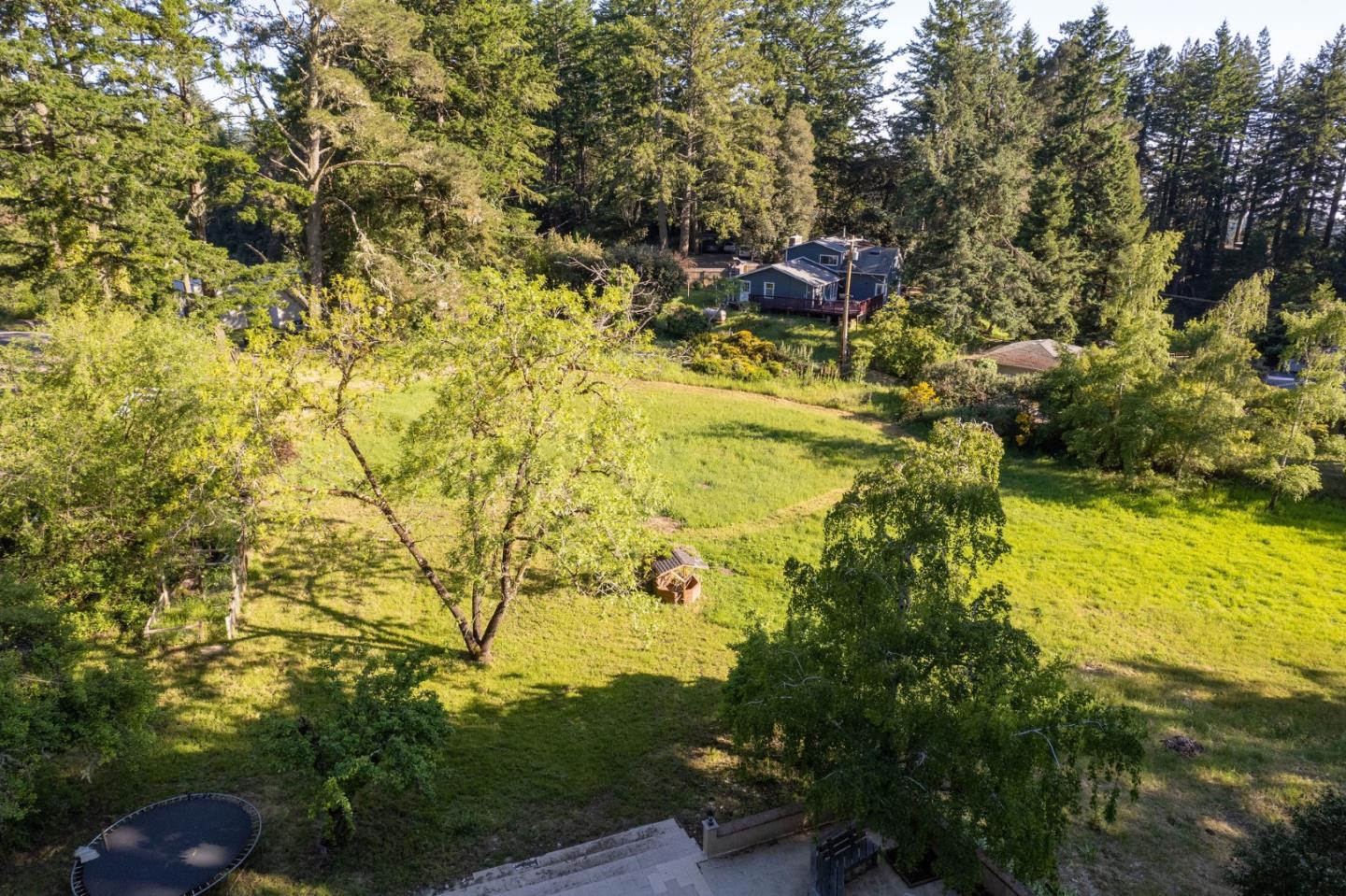161 Ware Road Woodside, CA 94062 - Photo 5 of 52 a backyard of a house with table and chairs