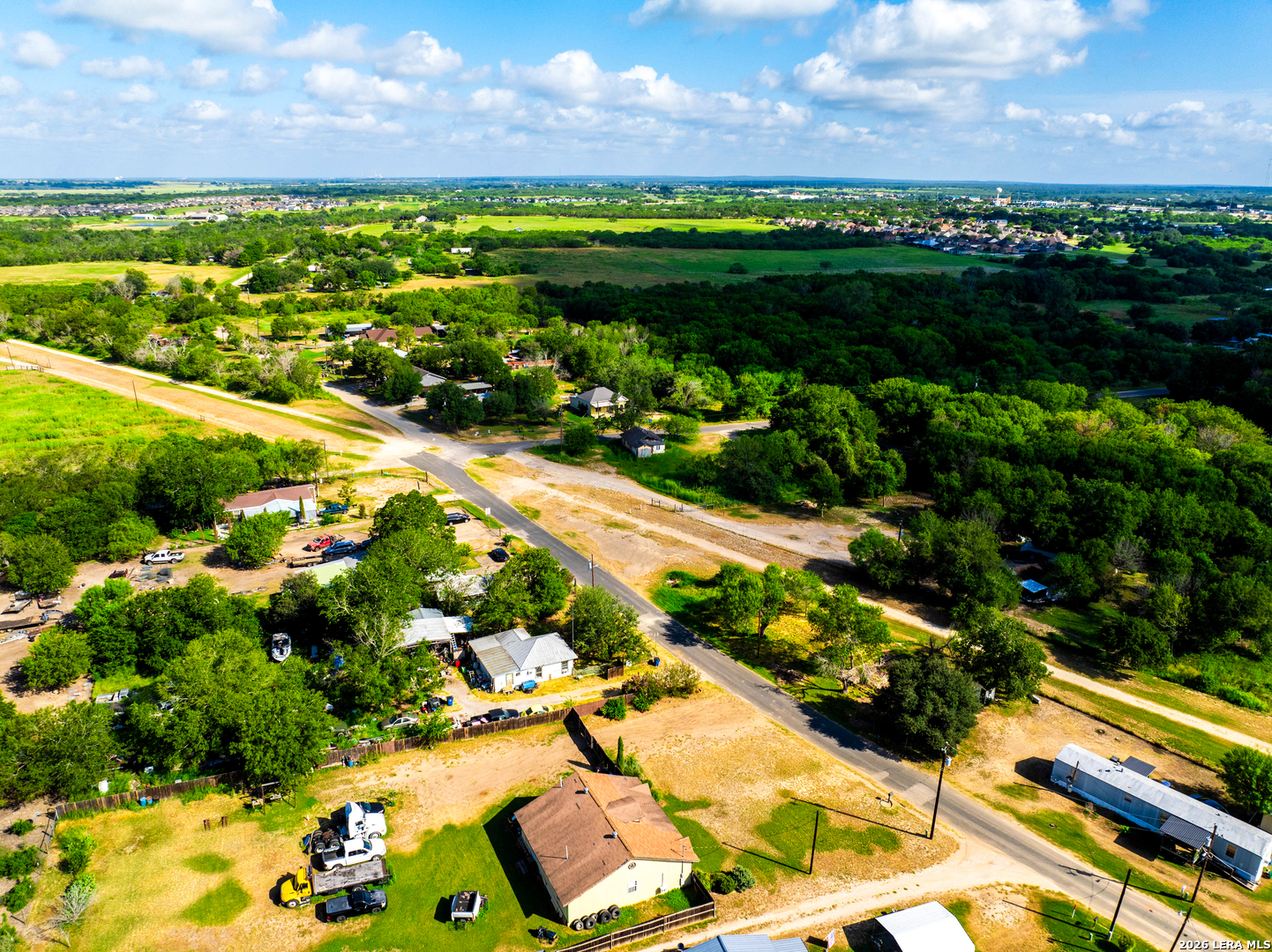 710 Goliad Road Floresville, TX 78114 - Photo 14 of 31 a view of a garden with a lake