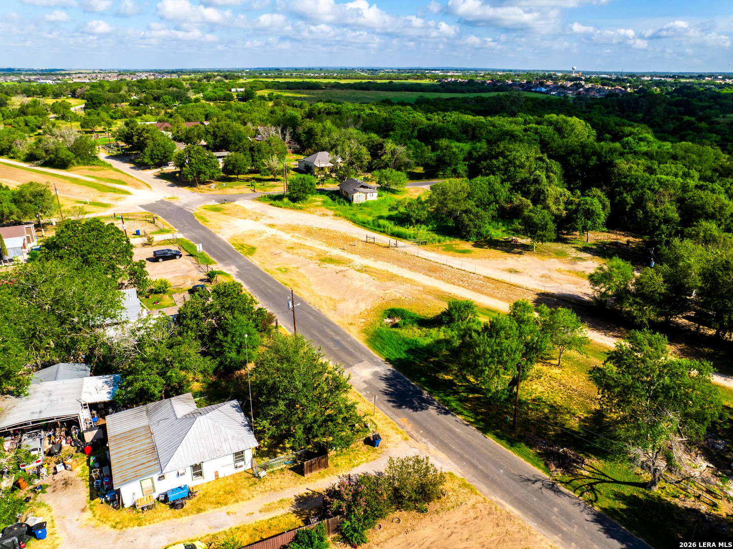 710 Goliad Road Floresville, TX 78114 - Photo 15 of 31 a view of a back yard of a house