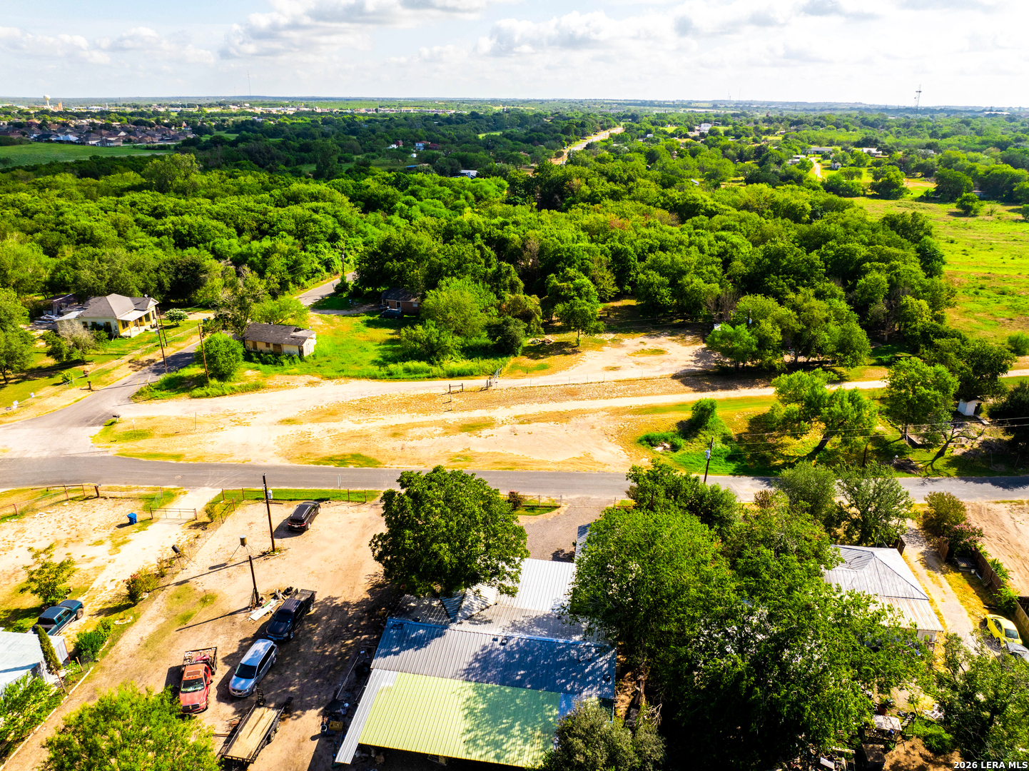 710 Goliad Road Floresville, TX 78114 - Photo 16 of 31 a view of a yard with an outdoor space