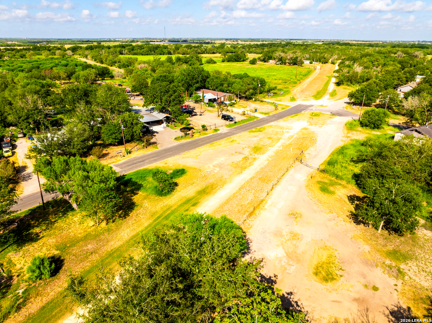 710 Goliad Road Floresville, TX 78114 - Photo 20 of 31 a view of a yard with an outdoor space