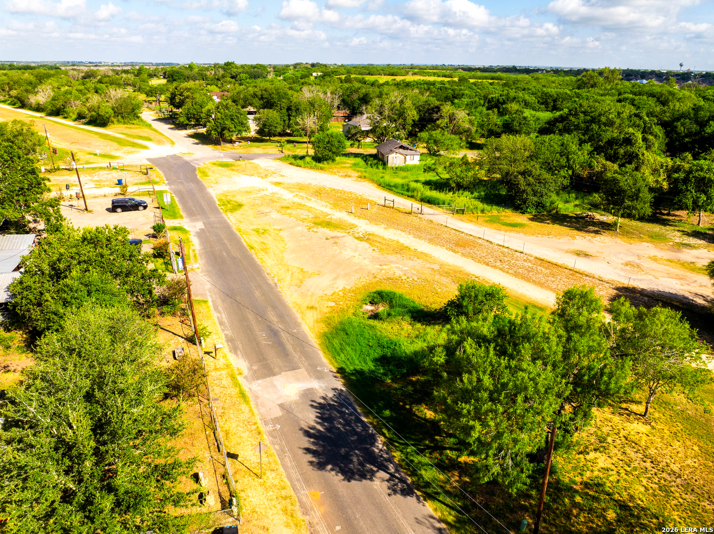 710 Goliad Road Floresville, TX 78114 - Photo 22 of 31 a view of swimming pool with an outdoor space and seating area