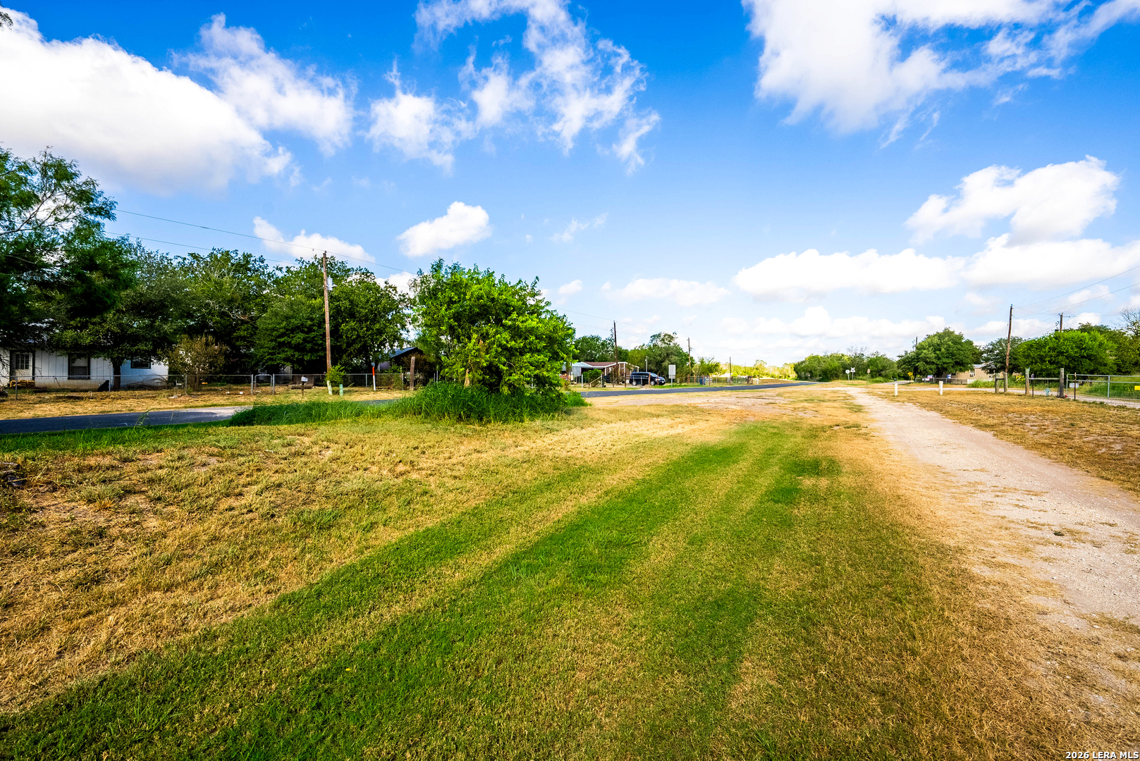 710 Goliad Road Floresville, TX 78114 - Photo 29 of 31 a view of yard with swimming pool and green space