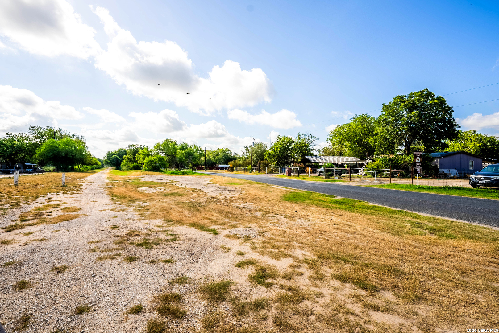 710 Goliad Road Floresville, TX 78114 - Photo 30 of 31 a view of swimming pool with a yard and fence