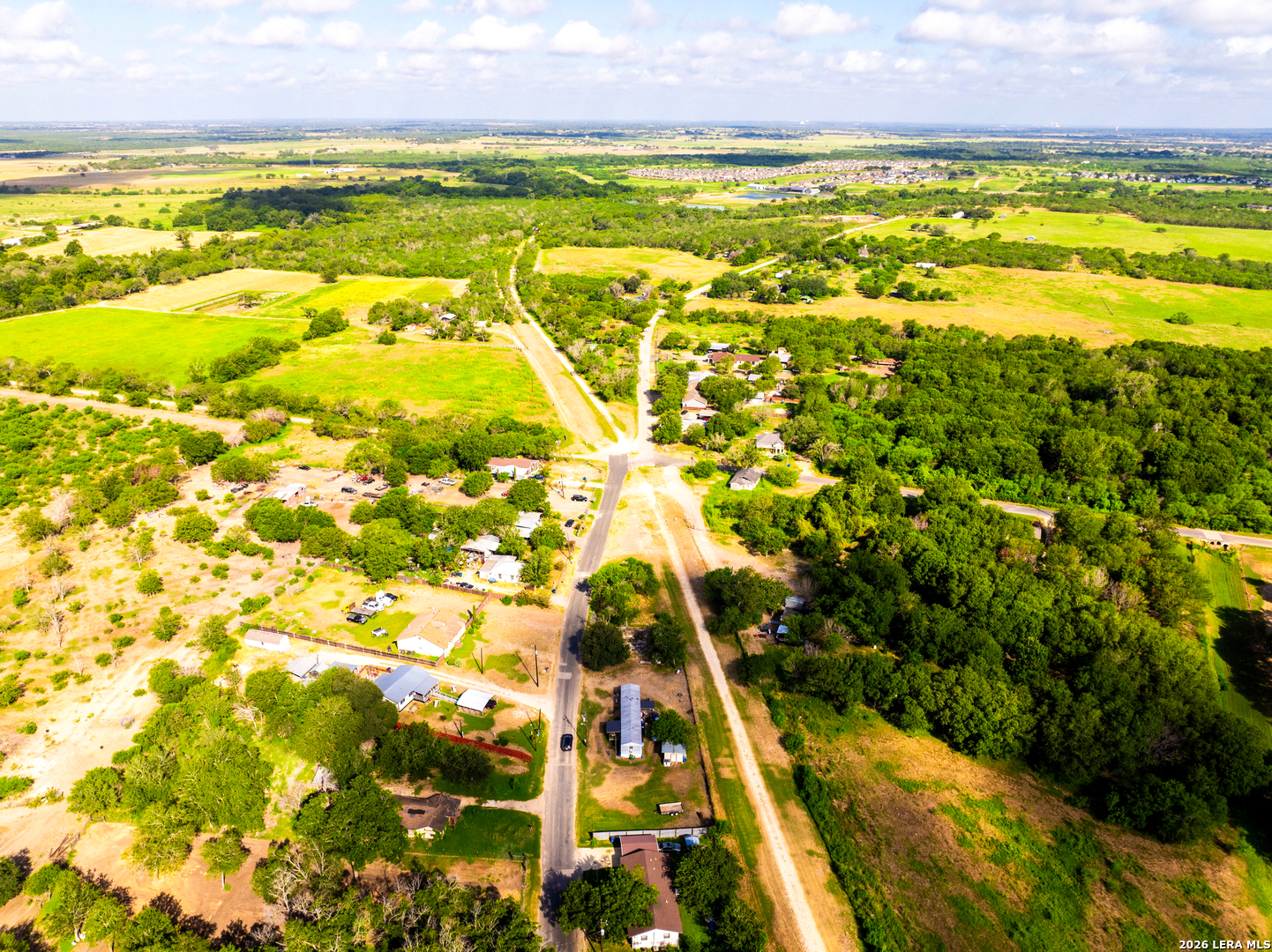 710 Goliad Road Floresville, TX 78114 - Photo 6 of 31 a view of an outdoor space and a lake view