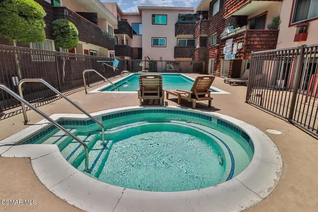 a view of swimming pool outdoor seating and yard