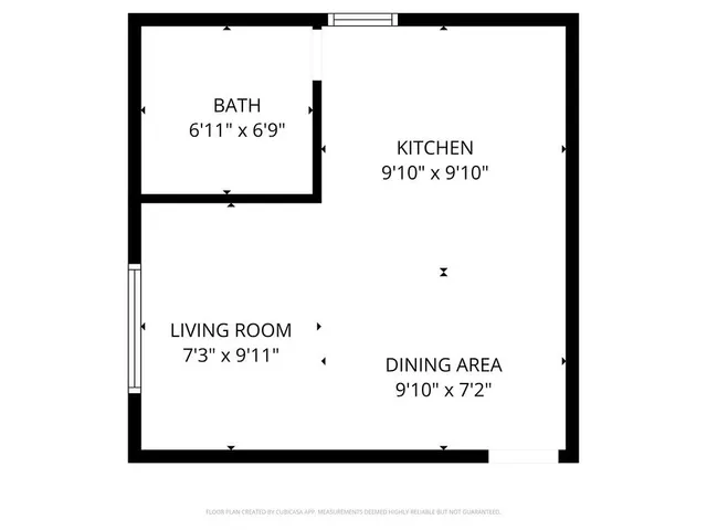 an empty room with wooden floor and a window