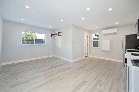 a view of kitchen with stainless steel appliances refrigerator and microwave