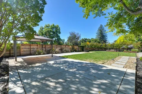 a front view of house with yard and outdoor seating