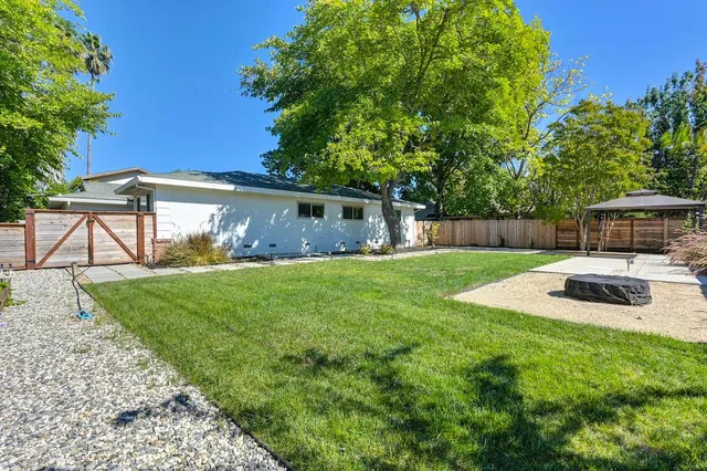 a view of a yard with a trampoline