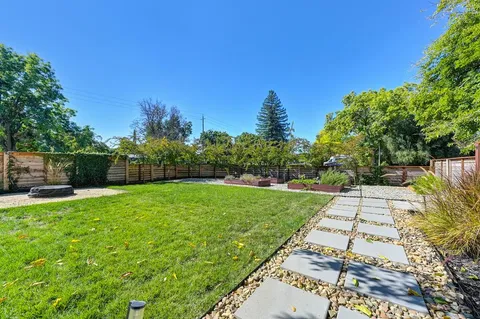 a backyard of a house with lots of green space