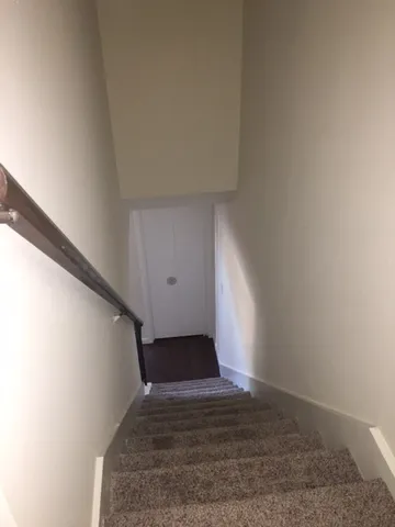 a view of a big room with staircase