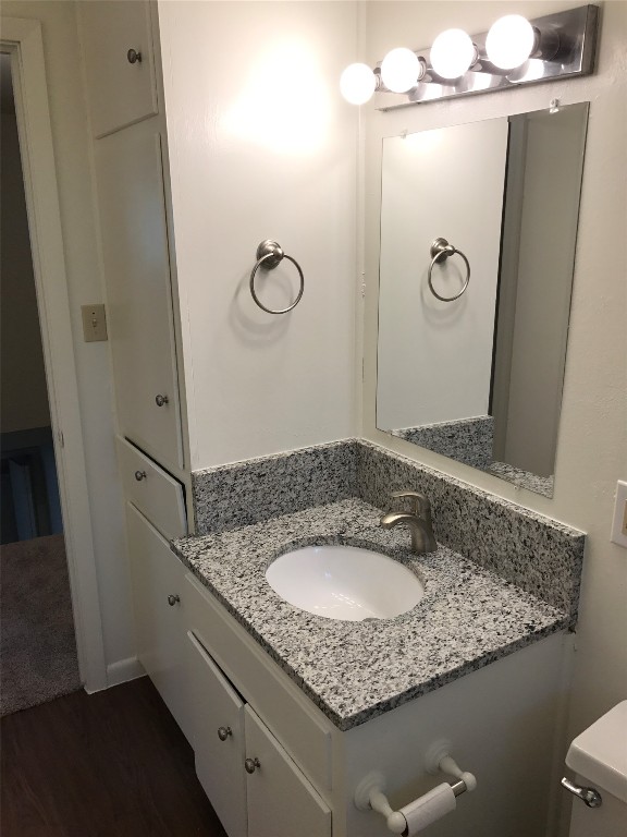 5001 Bull Creek Road, Unit 108 Austin, TX 78731 - Photo 6 of 21 a bathroom with a granite countertop sink a mirror and shower