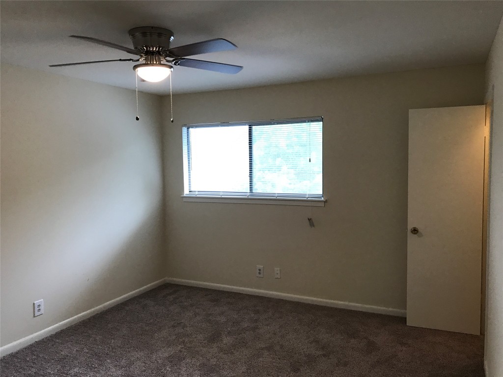 5001 Bull Creek Road, Unit 108 Austin, TX 78731 - Photo 9 of 21 an empty room with a window