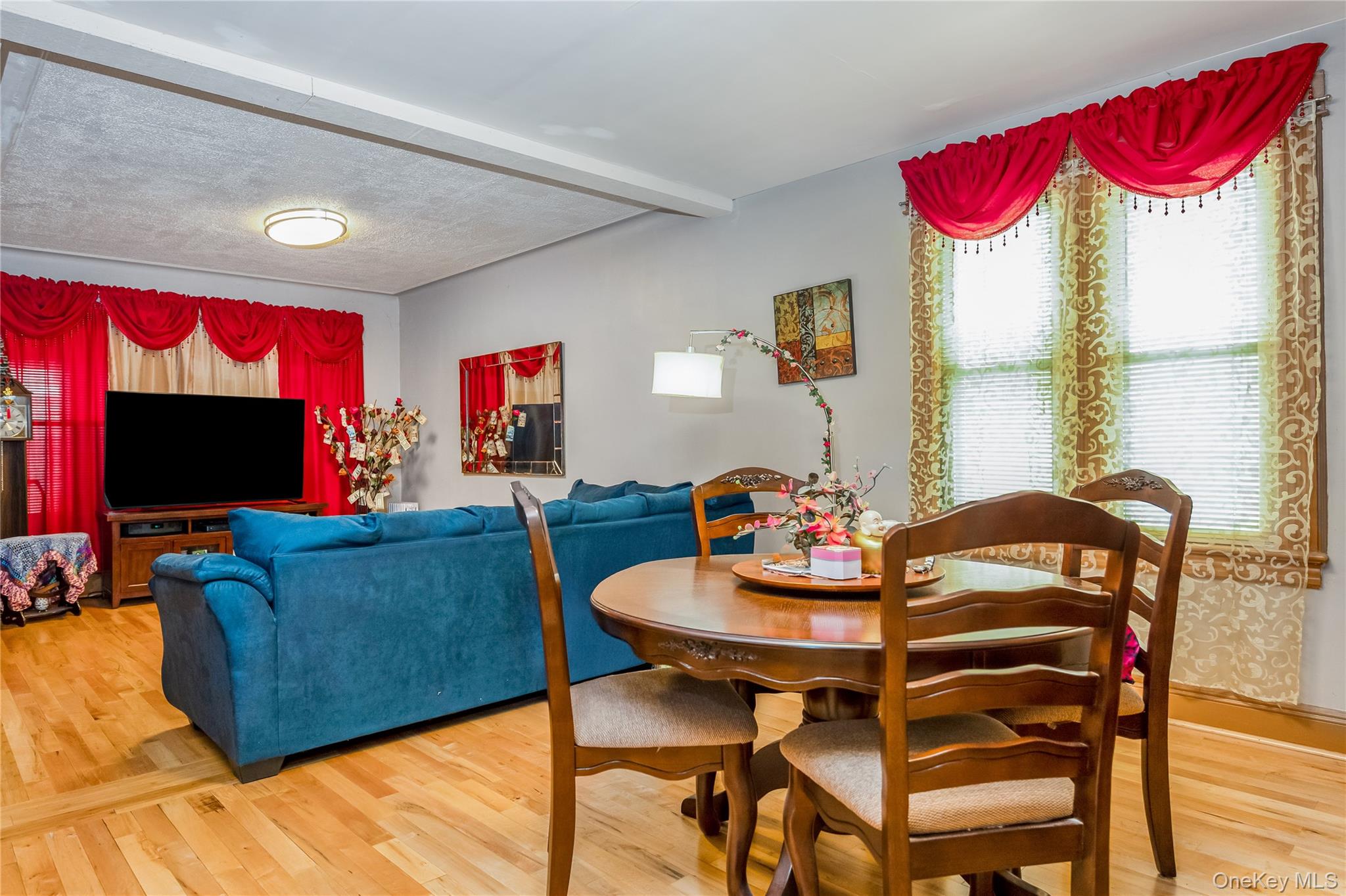 80-50 88th Road Queens, NY 11421 - Photo 9 of 21 a living room with furniture and a flat screen tv