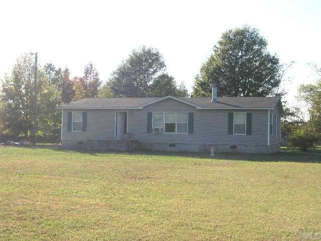 998 Bobbitt Road Kittrell, NC 27544 - Photo 1 of 4 a large house with a large pool in front of it