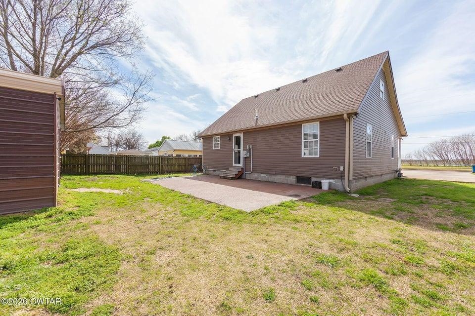 524 South Main Street Ridgely, TN 38080 - Photo 19 of 23 a view of a house with backyard and a tree