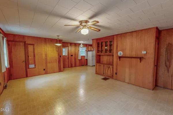 a kitchen with refrigerator and window