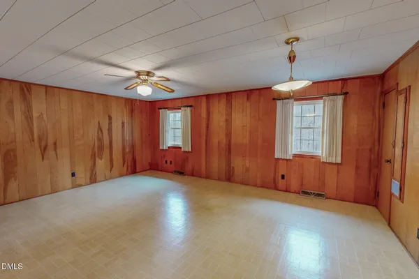 a view of a hallway with wooden shelves