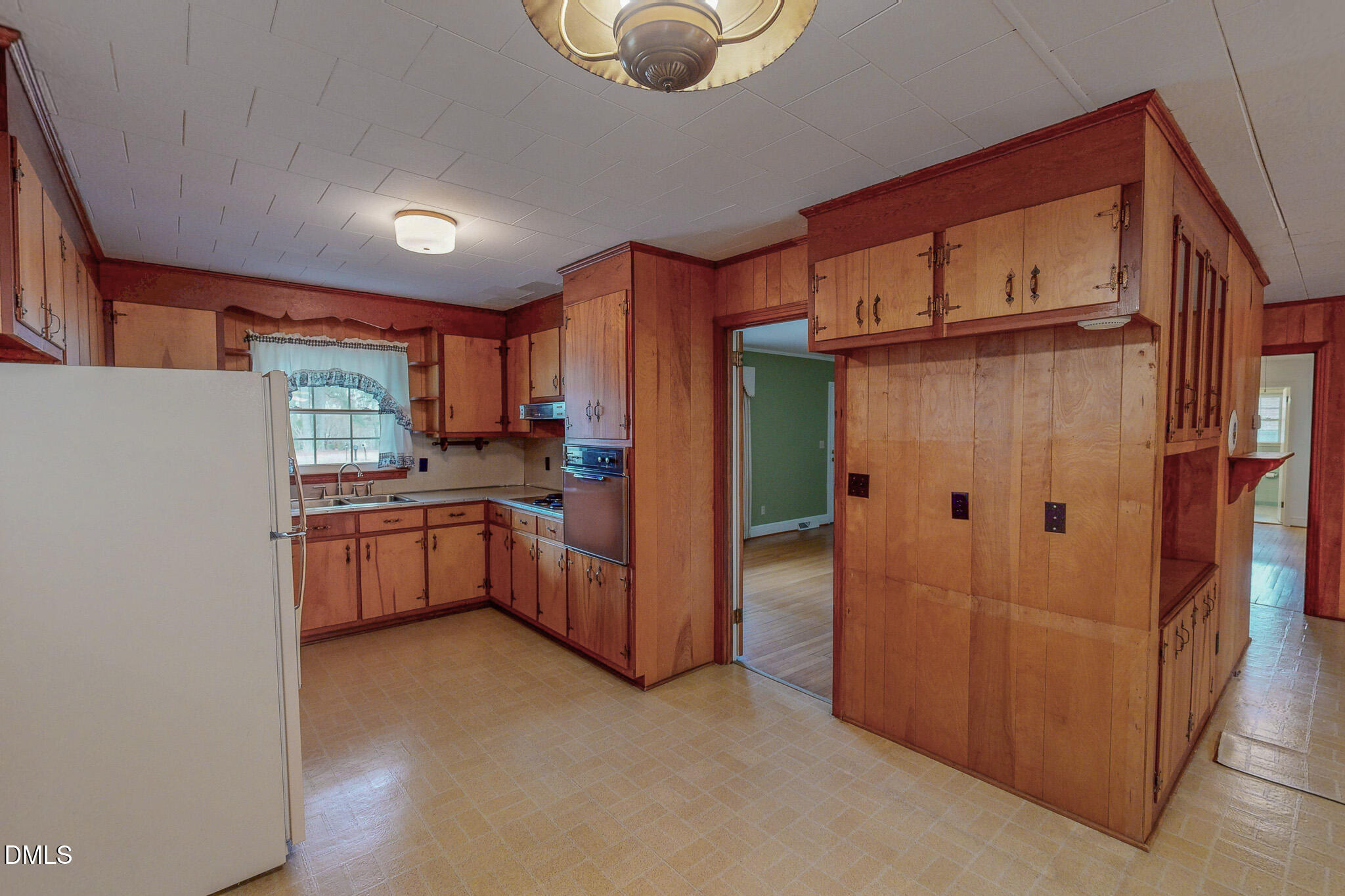 333 Allensville Road Roxboro, NC 27574 - Photo 19 of 43 a kitchen with granite countertop a refrigerator and a stove top oven