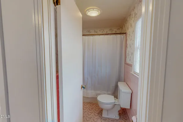 a bathroom with a shower and a tub