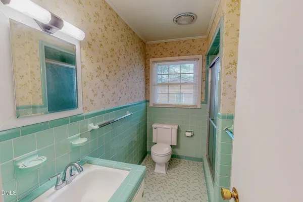 a bathroom with a sink and mirror