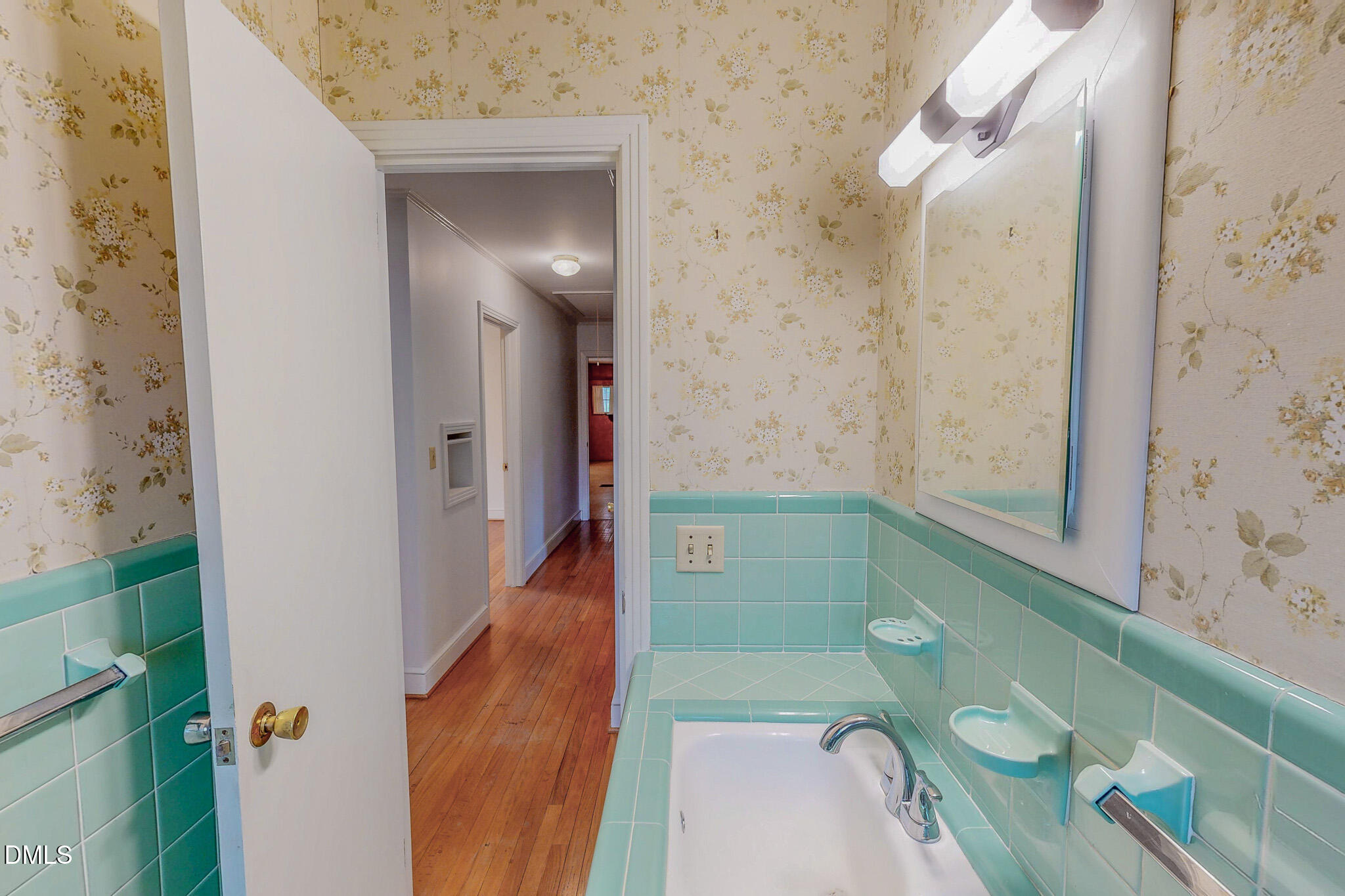 333 Allensville Road Roxboro, NC 27574 - Photo 36 of 43 a bathroom with a sink and mirror
