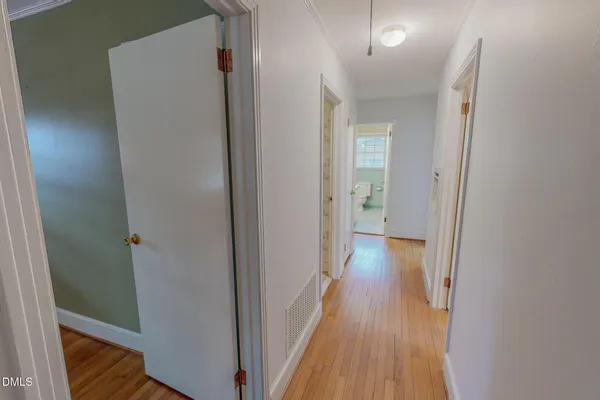 a view of an empty room with a fireplace